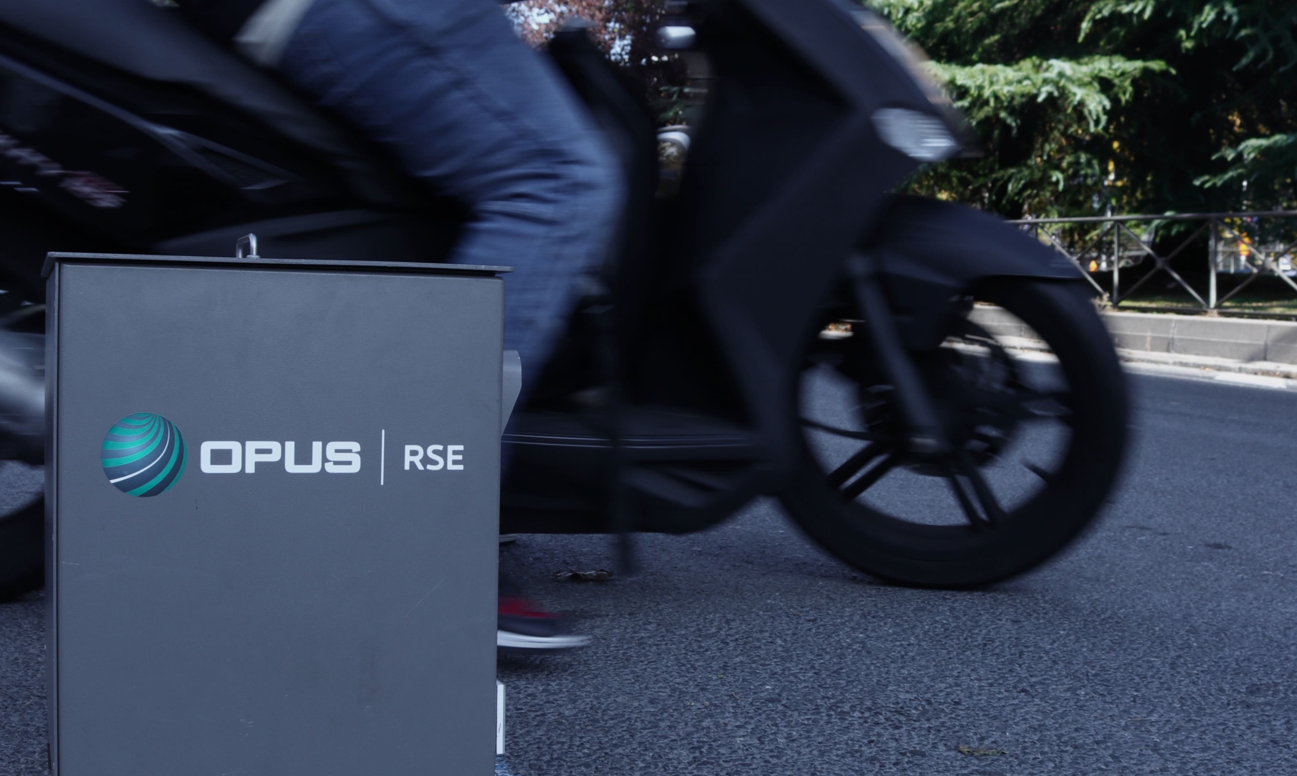 opus remote sensing device in spain while a motorcycle passes in front of and analyzes it
