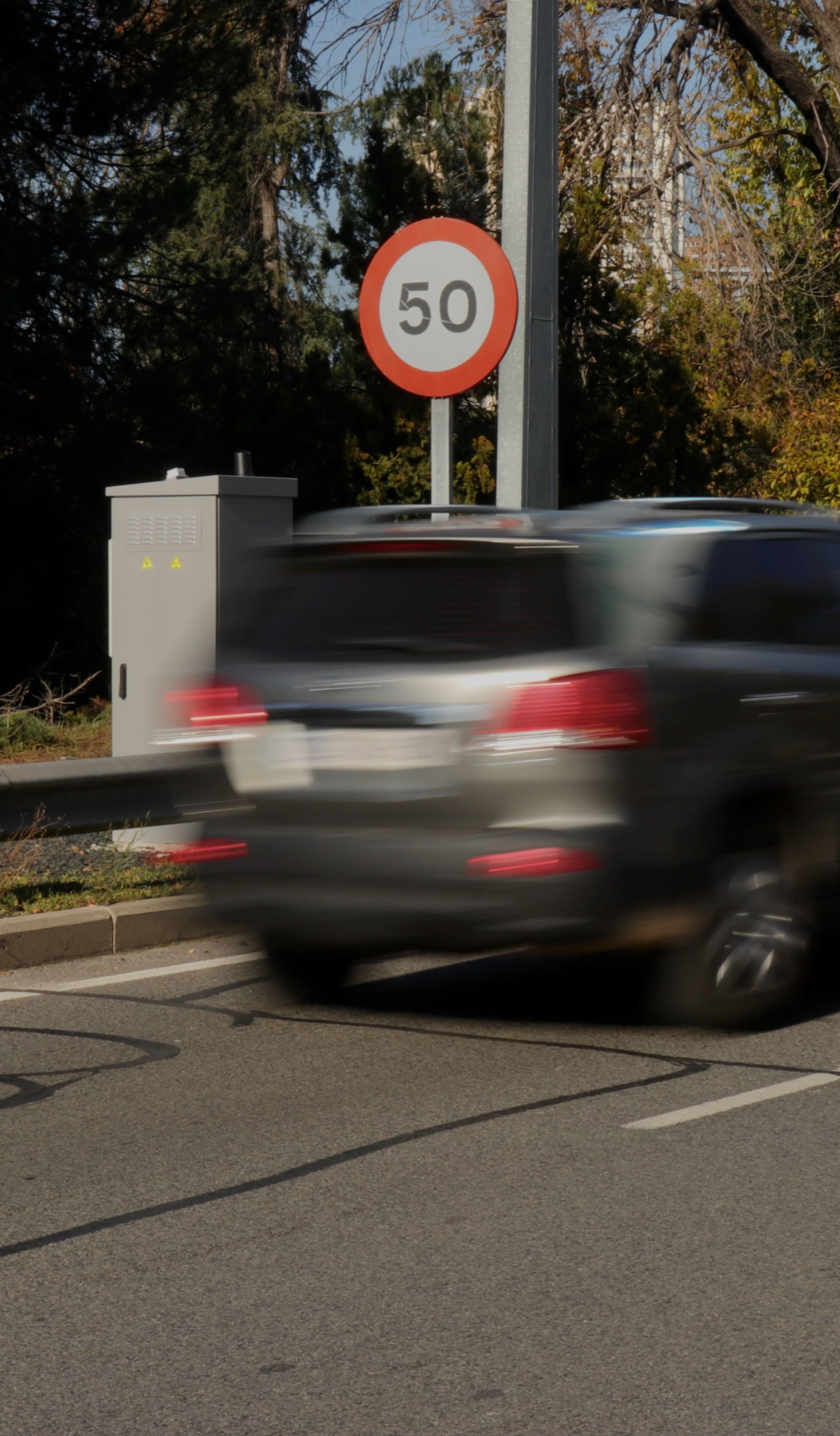 car passing in front of fixed teledetection device on the m30 in madrid