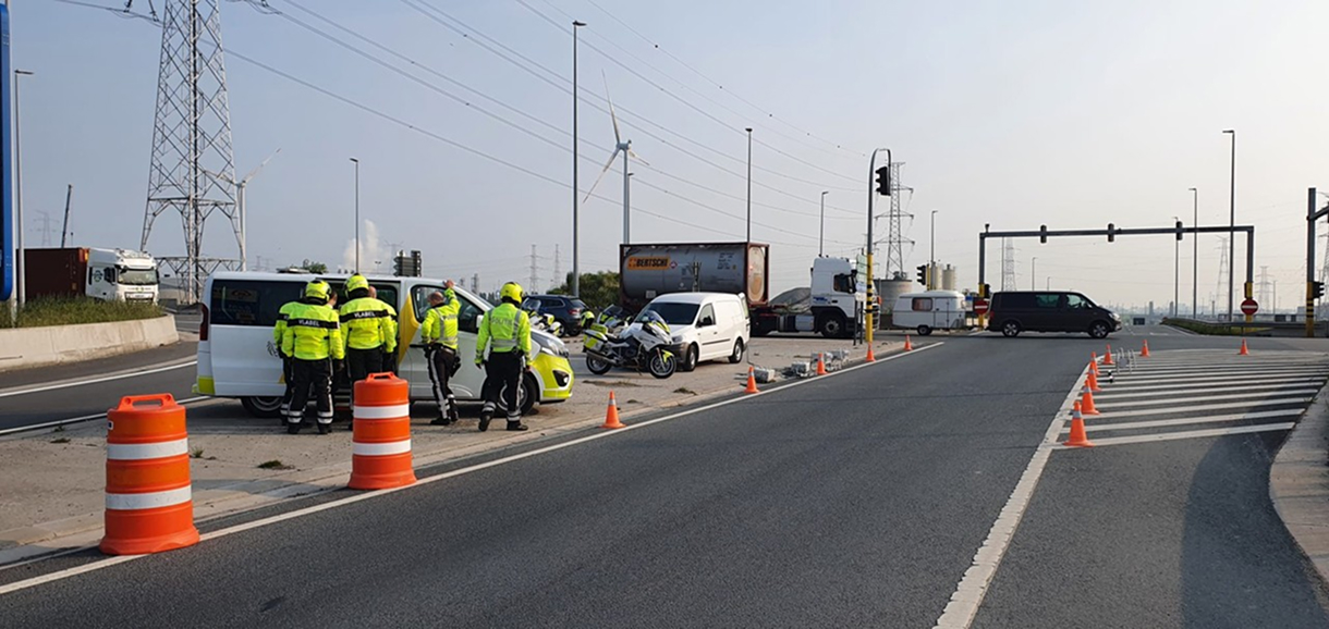 Police monitoring as trucks undergo emissions analysis with Opus RSD in Antwerp, achieving a 25x increase in detecting tampered vehicles