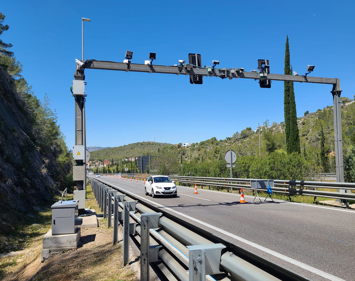 Car passing in front of a fixed OPUS remote sensing device on the C-32 freeway in the direction of