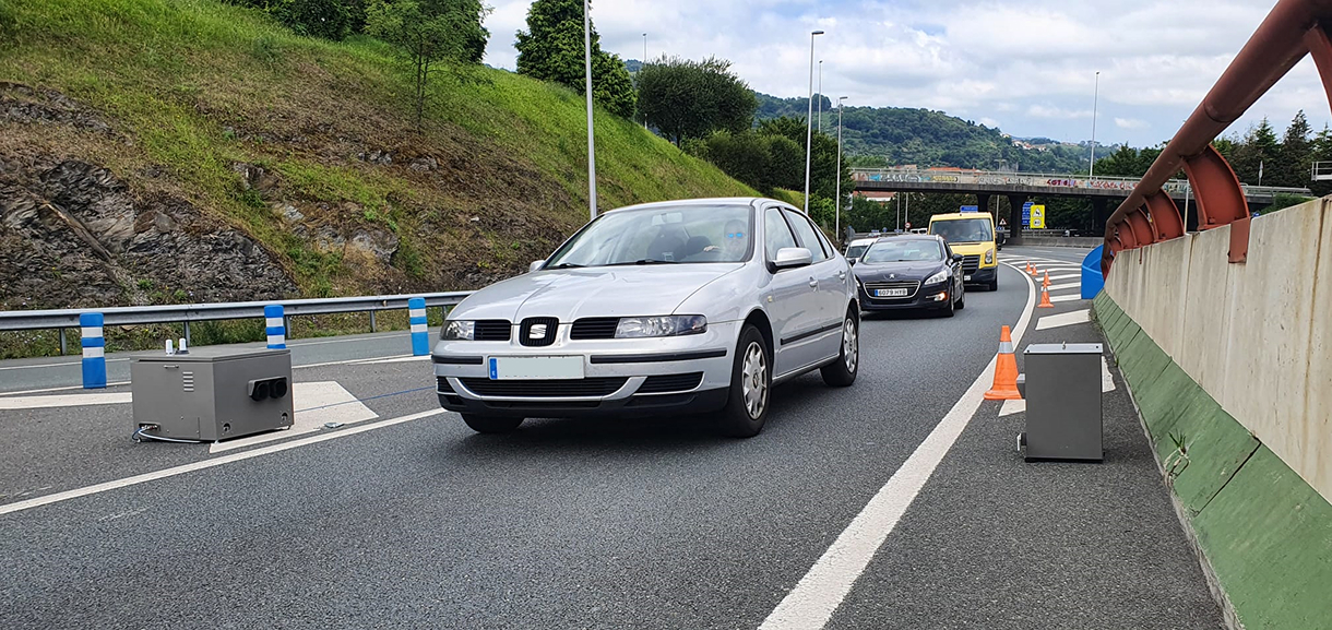 cars passing in front of opus remote sensing device in bilbao