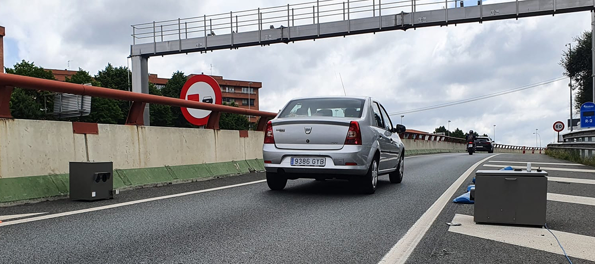 cars passing in front of opus remote sensing device in bilbao