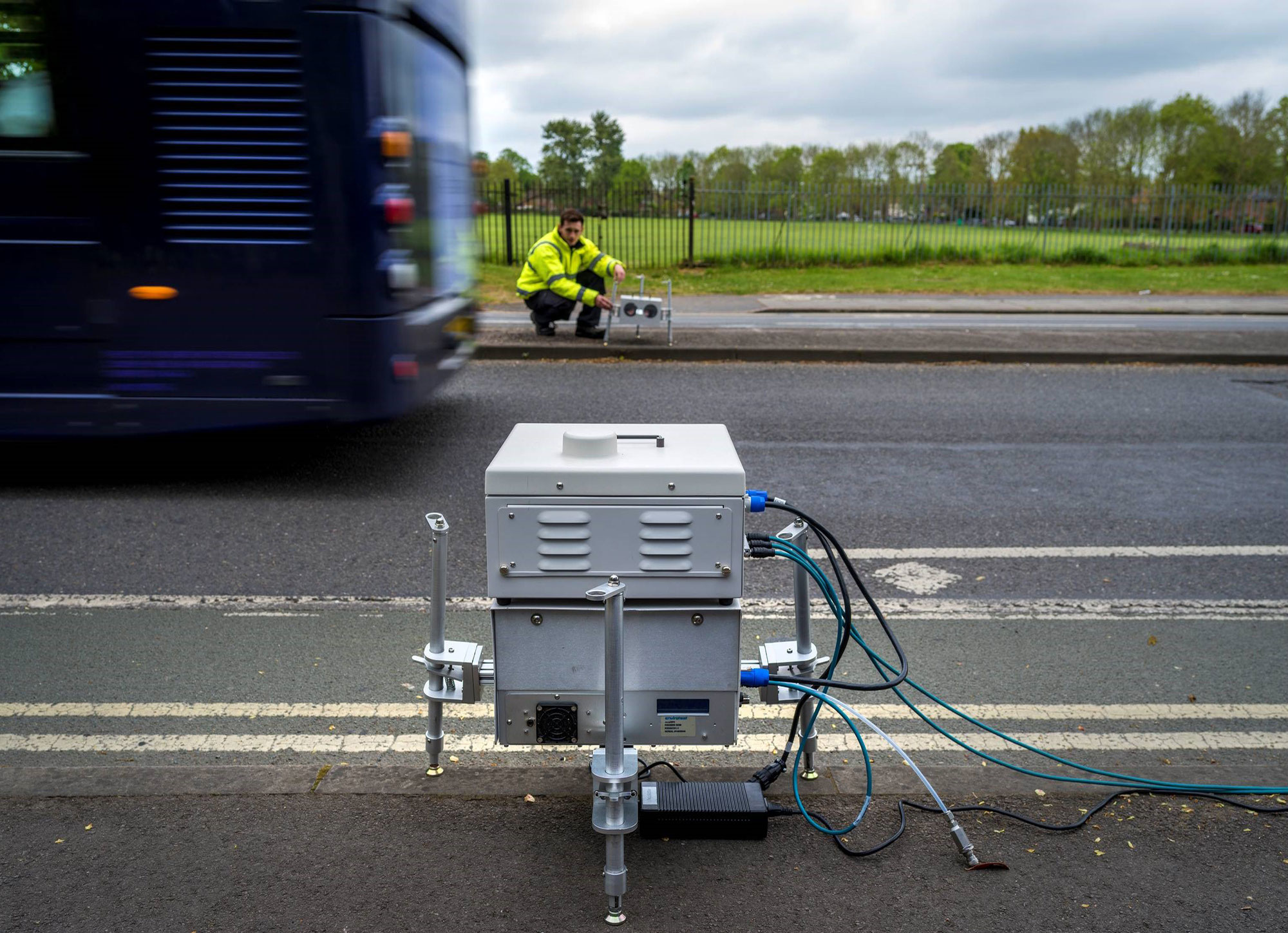 OPUS worker installing the remote sensing device on the roadside