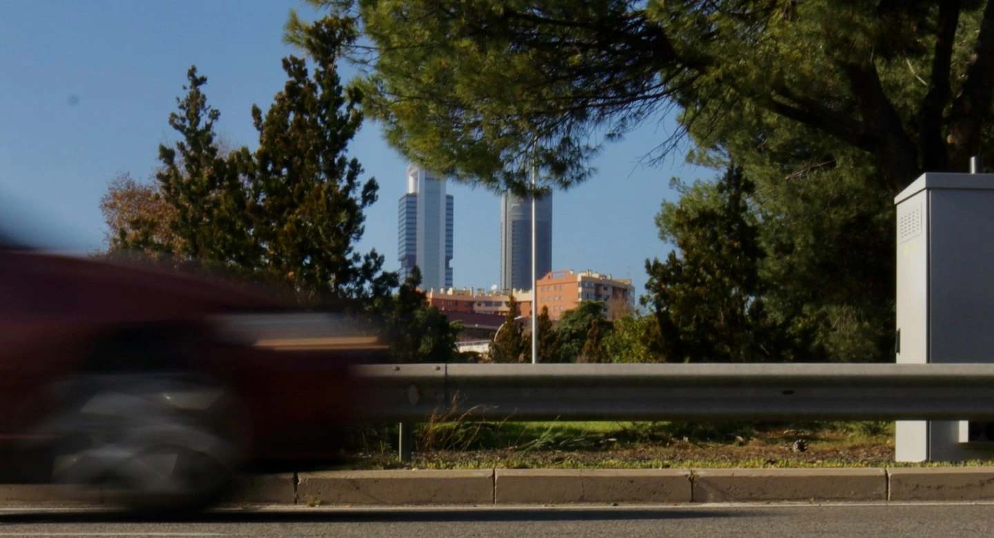 A car passing in front of the fixed cabin in Madrid m30